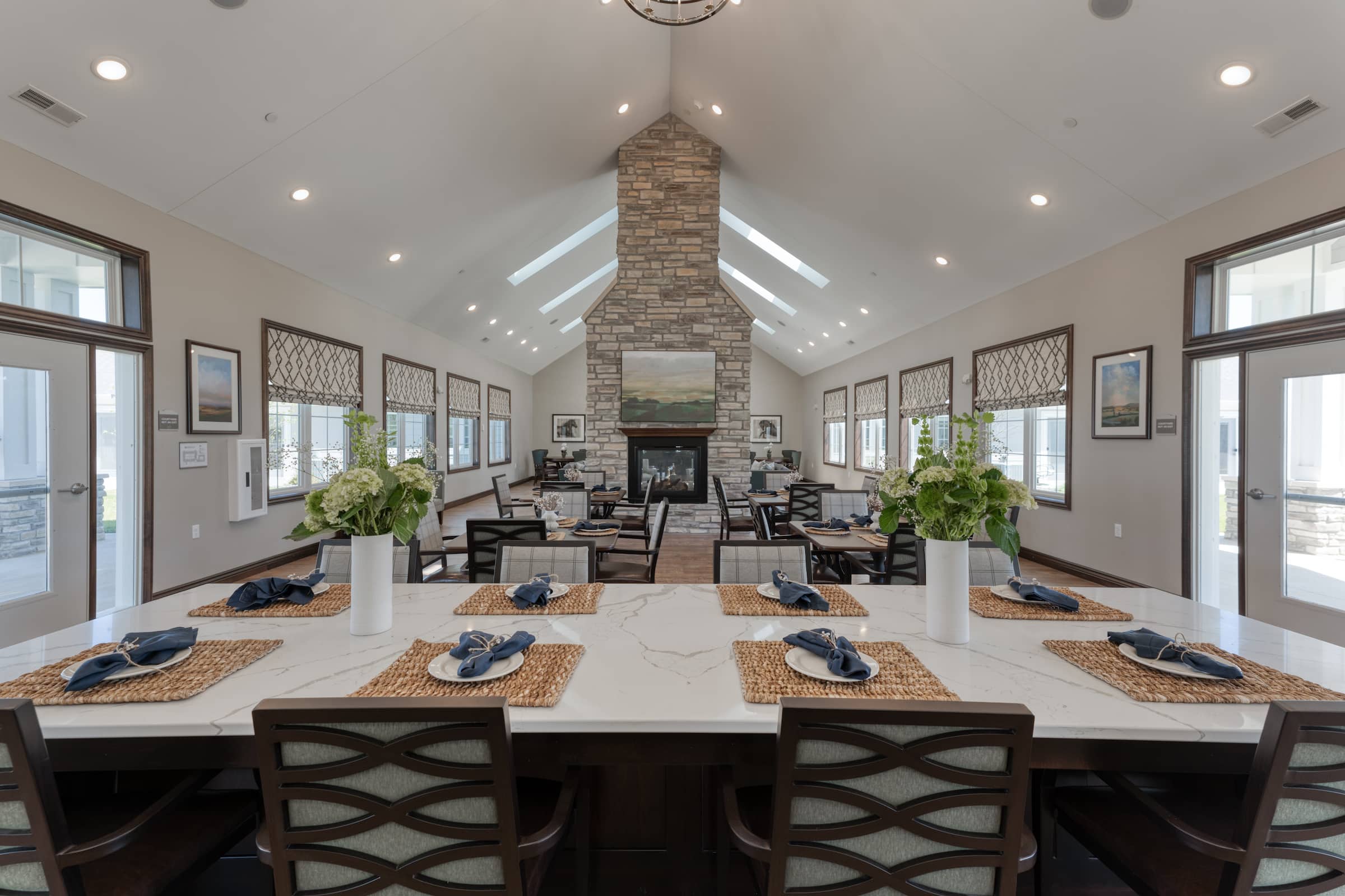 Communal dining space with abundant natural light